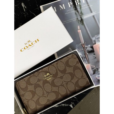 Жіночий гаманець Coach персиковий на багато відділень великий Коуч