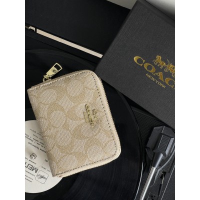 Жіночий гаманець Coach молочний міні Коуч