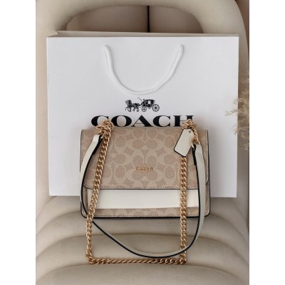 Сумка жіноча Coach Mini Klare Crossbody in Signature Canvas через плече пудровий Коуч Сумка жіноча Coach Mini Klare Crossbody in Signature Canvas через плече пудровий Коуч
